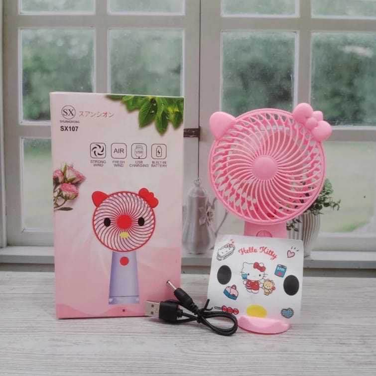 UAnybKUzqEuh7e9Z0pPLnHHsVG1L1CSxNMI1KsLR Kipas Angin Genggam Tangan Karakter Dengan Penyangga HP - Pink - Image 1